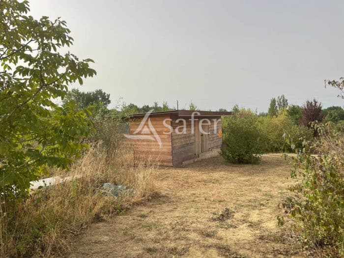 Environ 6,4 ha de terrain avec bâtiments volailles - Proche Toulouse